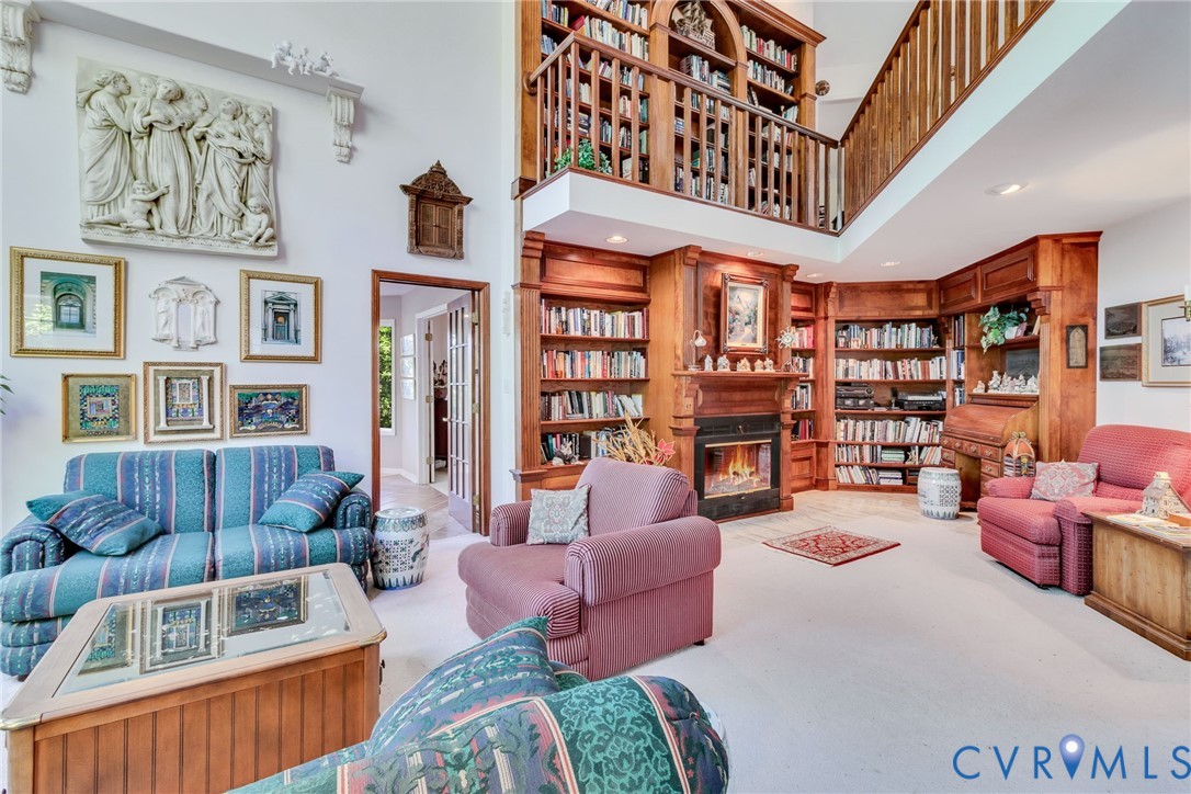 1167 Ottoman Ferry Road Lancaster, VA 22503 - Photo 13 of 52 Two-story living area featuring extensive built-in
