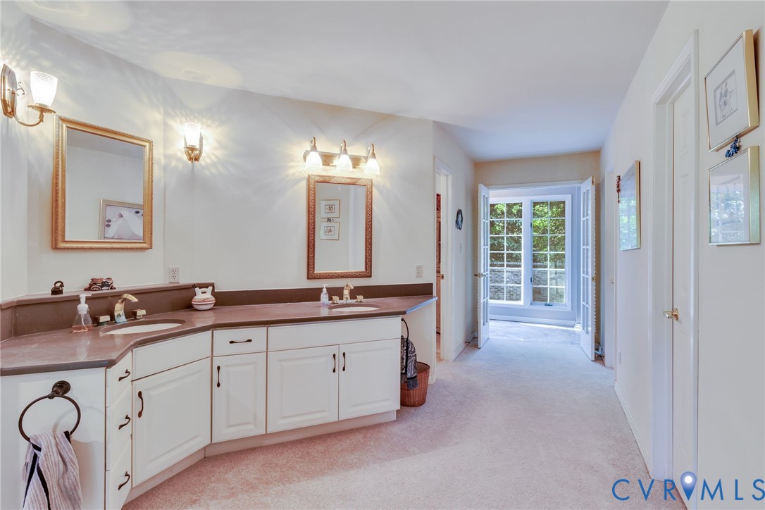 1167 Ottoman Ferry Road Lancaster, VA 22503 - Photo 22 of 52 Dual vanity with integrated sinks, white cabinetry