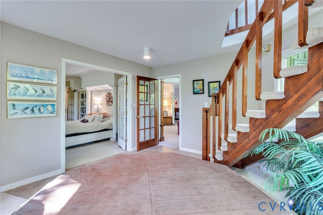 1167 Ottoman Ferry Road Lancaster, VA 22503 - Photo 27 of 52 Entry foyer with broadloom carpeting and tile floo