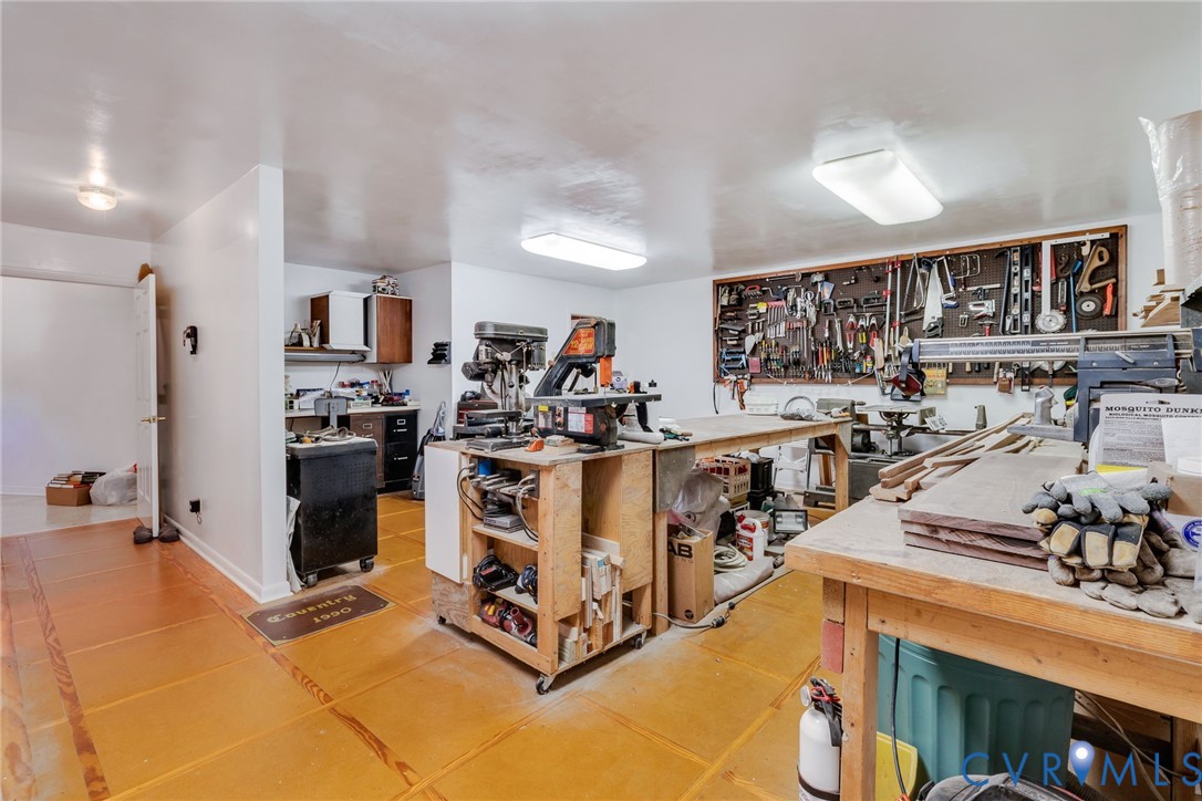 1167 Ottoman Ferry Road Lancaster, VA 22503 - Photo 30 of 52 Dedicated workspace featuring extensive tool stora