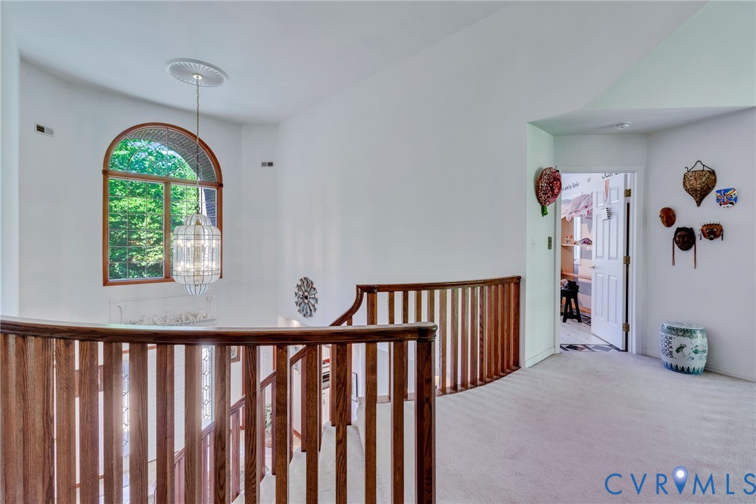 1167 Ottoman Ferry Road Lancaster, VA 22503 - Photo 32 of 52 Upper-level landing featuring light gray carpeting