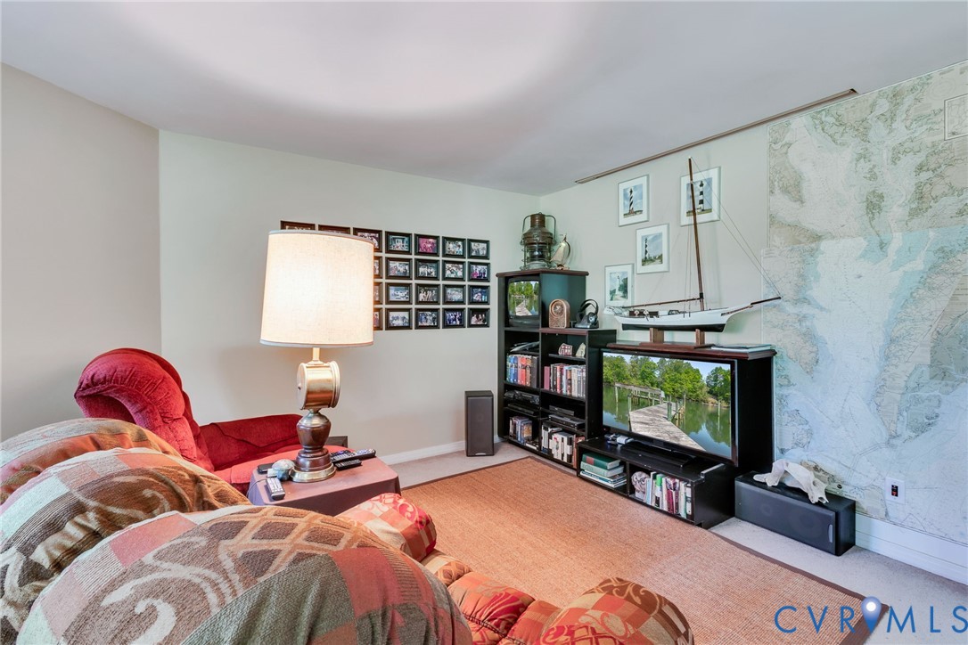1167 Ottoman Ferry Road Lancaster, VA 22503 - Photo 34 of 52 Recessed lighting illuminates neutral walls and a