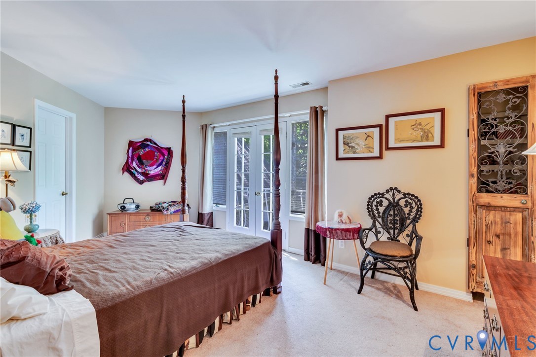 1167 Ottoman Ferry Road Lancaster, VA 22503 - Photo 38 of 52 Neutral-toned walls complement carpeted flooring a