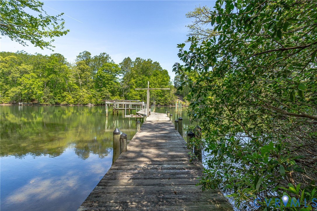 1167 Ottoman Ferry Road Lancaster, VA 22503 - Photo 4 of 52 Private wooden dock extending into calm waters, fe