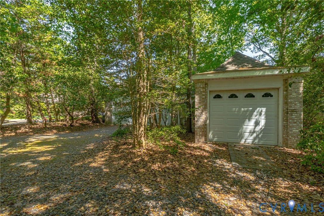 1167 Ottoman Ferry Road Lancaster, VA 22503 - Photo 41 of 52 Detached brick structure featuring a single garage