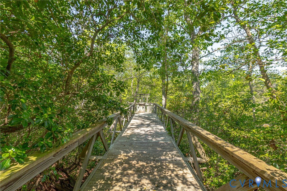 1167 Ottoman Ferry Road Lancaster, VA 22503 - Photo 47 of 52 Elevated wood-finish walkway with natural wood rai