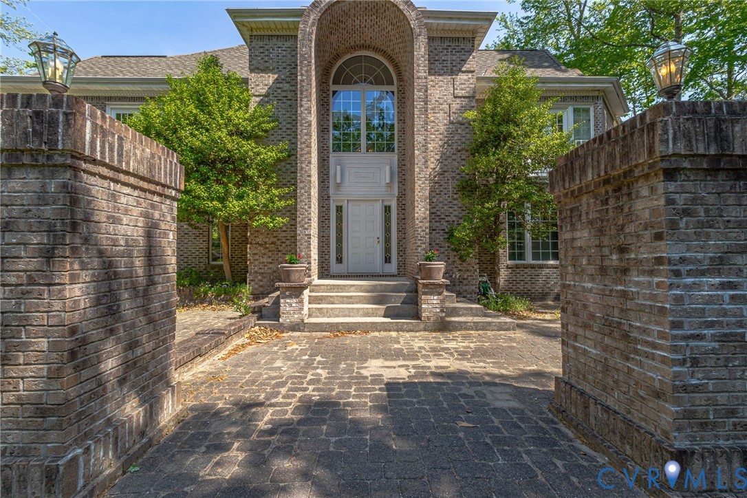 1167 Ottoman Ferry Road Lancaster, VA 22503 - Photo 9 of 52 Stately brick facade with arched entryway, multi-p