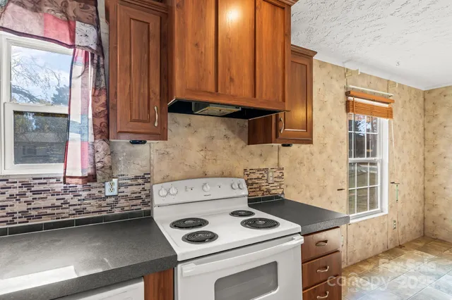 a kitchen with a stove and a sink