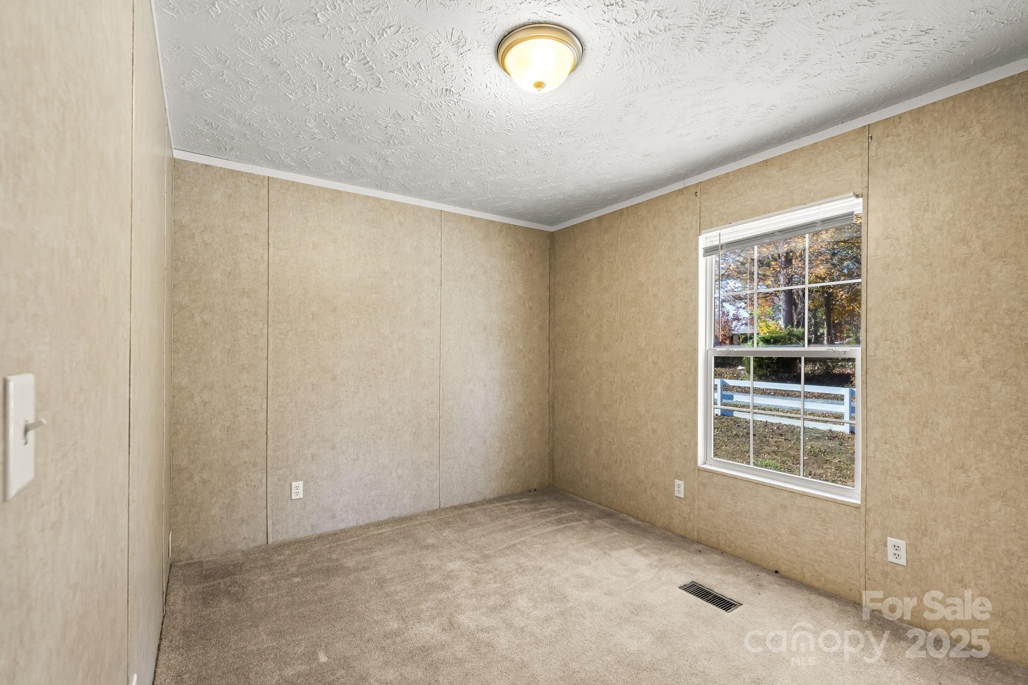 1060 Beckham Road Salisbury, NC 28147 - Photo 23 of 28 a view of an empty room with a window