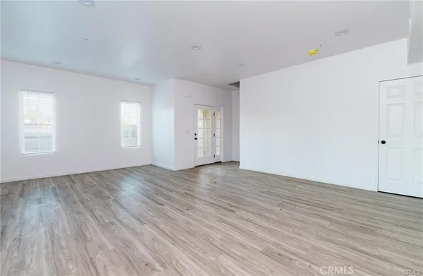 an empty room with wooden floor