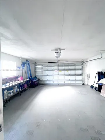 a view of a livingroom with furniture and a garage