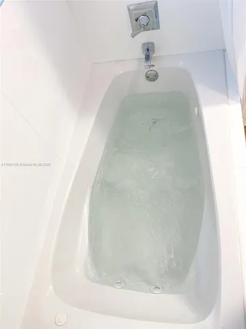 a view of a bathtub in a bathroom