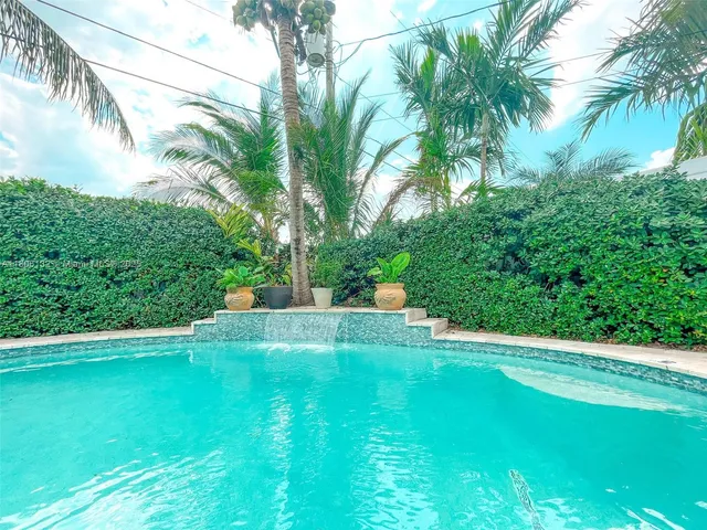 a view of a backyard with a small pool
