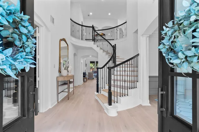 a dining room with a table and chairs