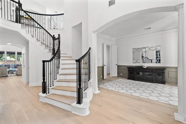 a bathroom with a sink mirror and toilet