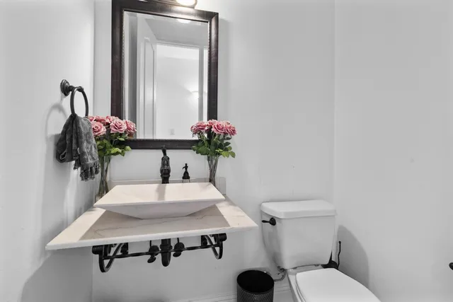 a living room with fireplace furniture and a flat screen tv