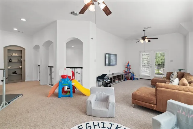 a bathroom with a granite countertop toilet a sink and a mirror