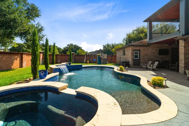 a view of a swimming pool with a patio