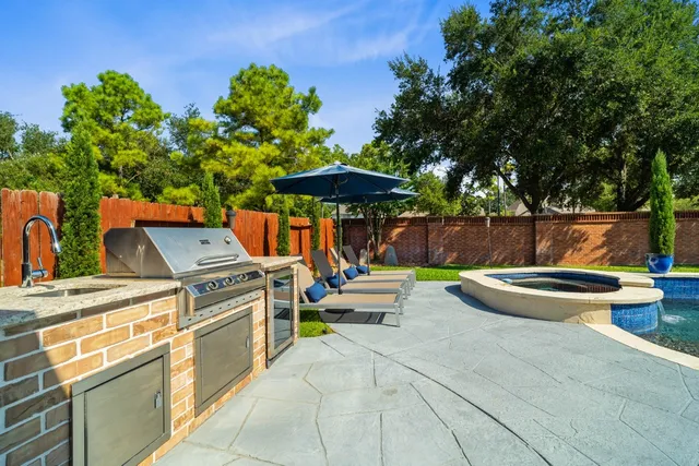 a outdoor space with patio couch and a potted plant