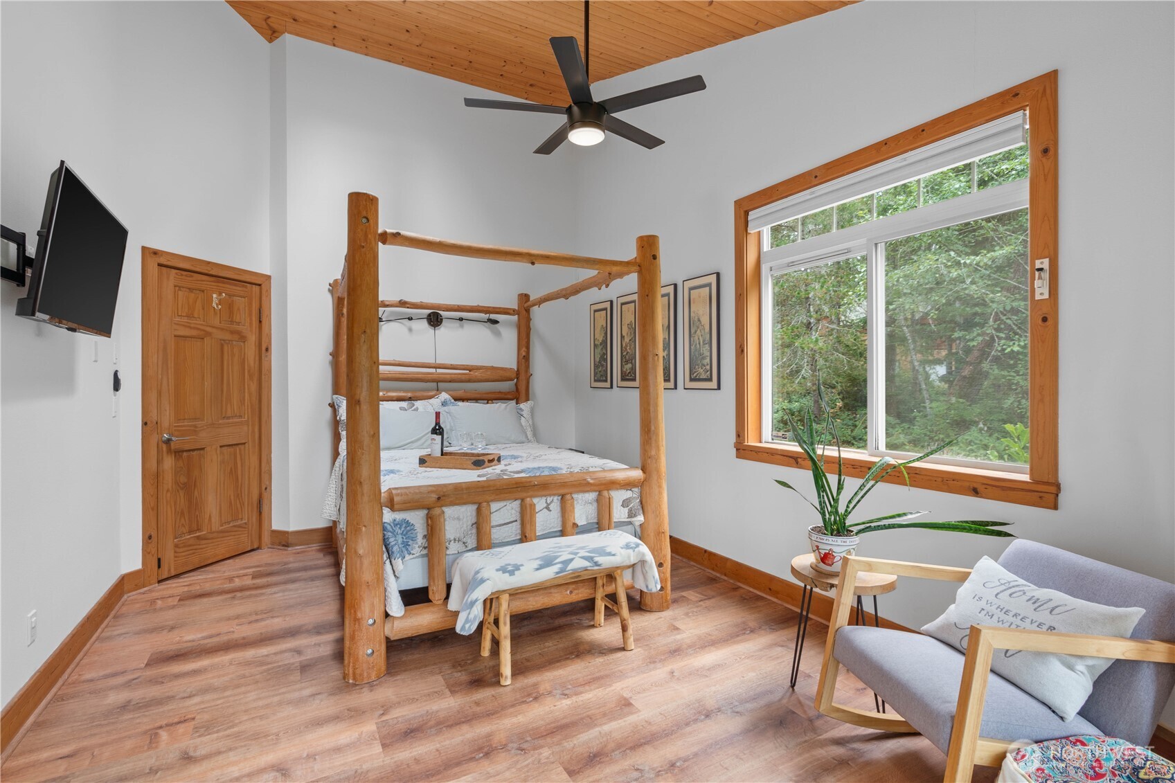 7131 Northeast Tahuya Blacksmith Road Belfair, WA 98528 - Photo 12 of 33 a bedroom with furniture and a window