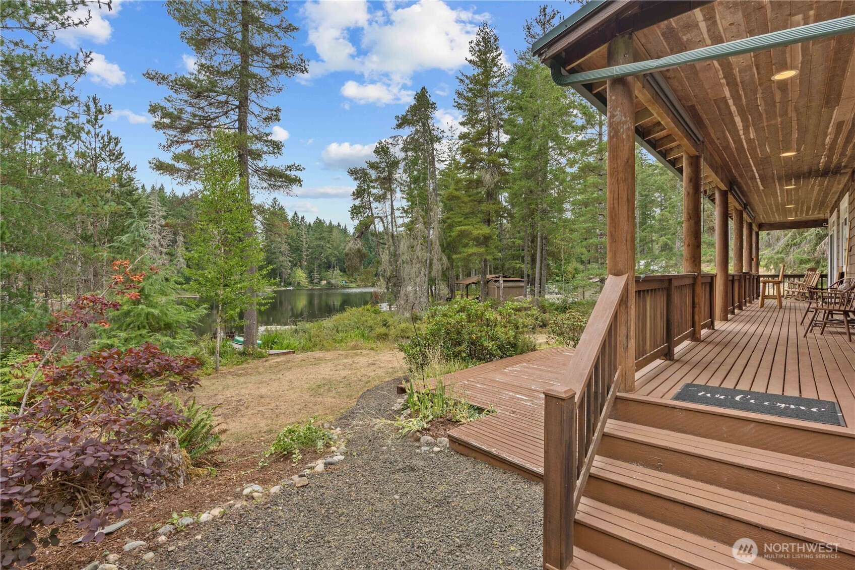 7131 Northeast Tahuya Blacksmith Road Belfair, WA 98528 - Photo 17 of 33 a view of a patio with two couches next to a yard