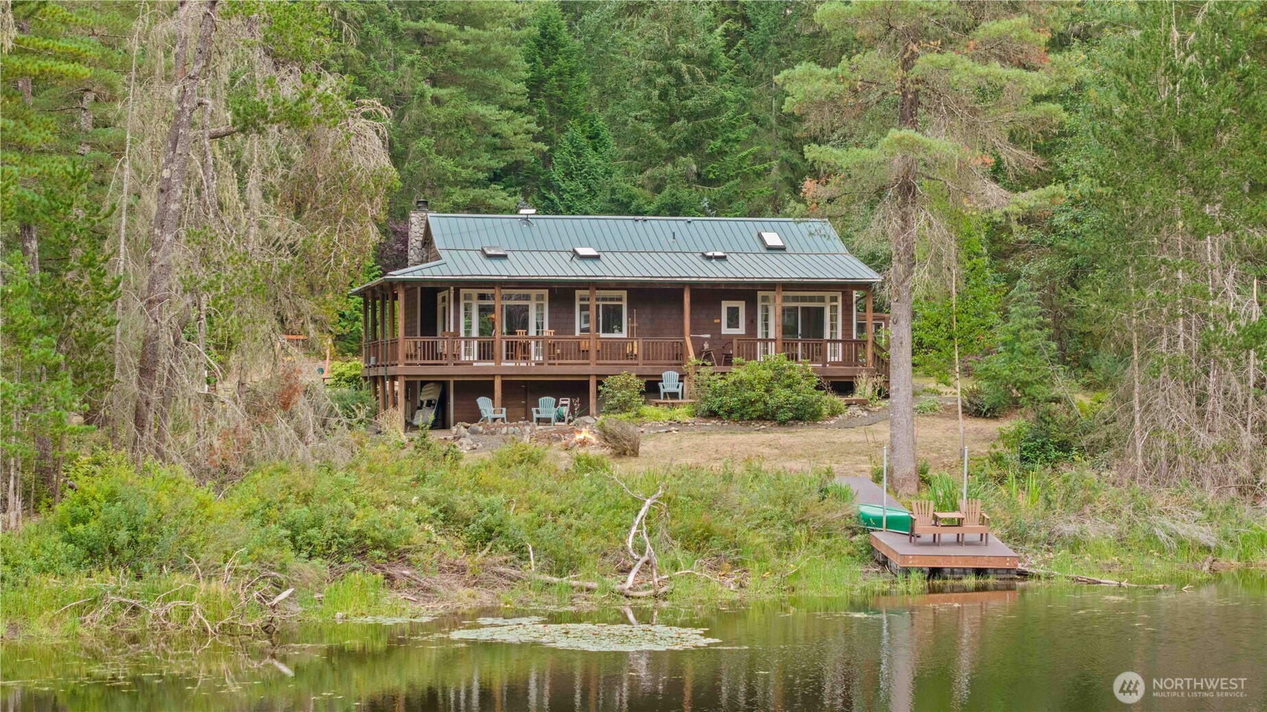 7131 Northeast Tahuya Blacksmith Road Belfair, WA 98528 - Photo 19 of 33 a aerial view of a house with a yard