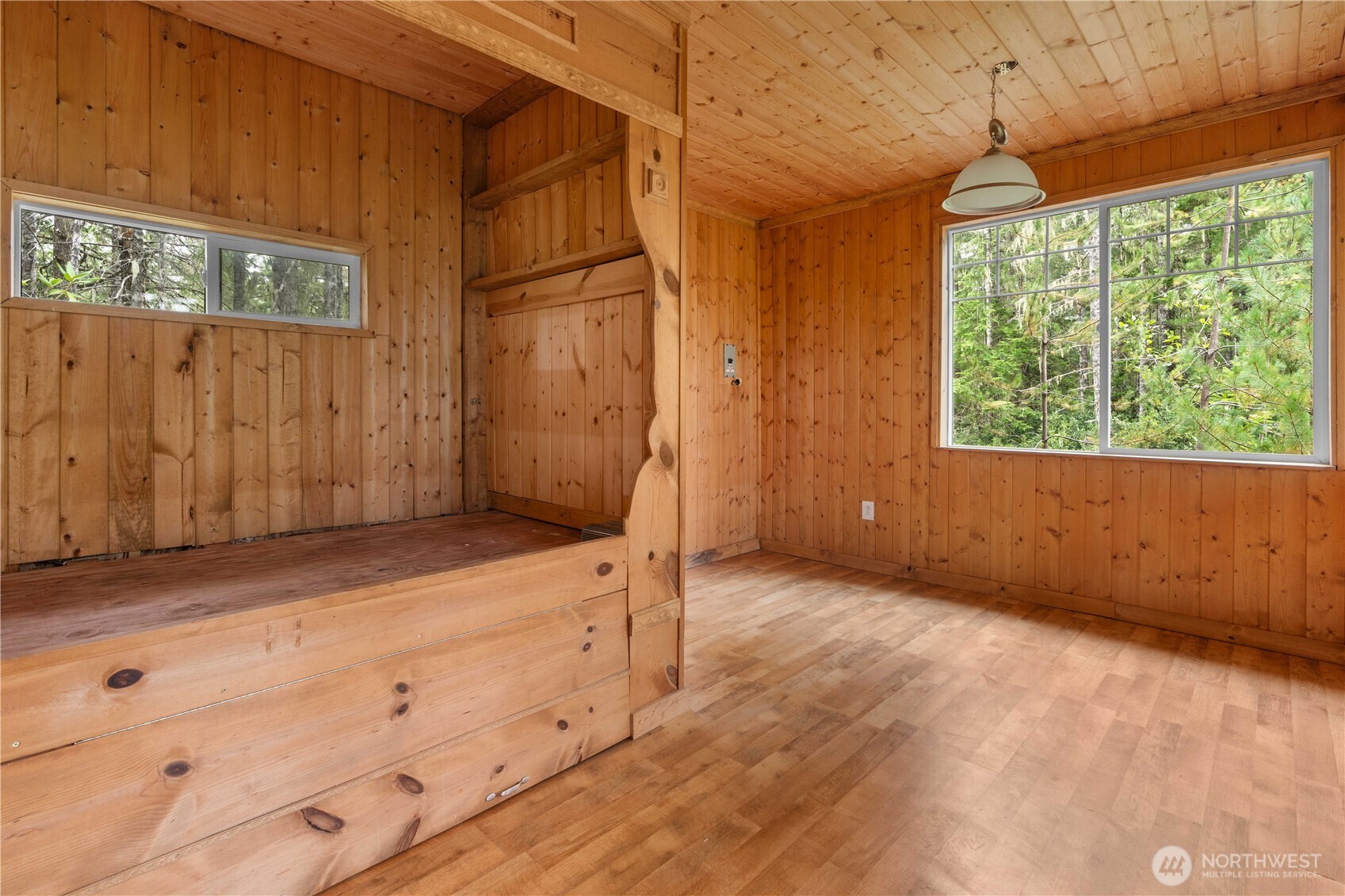 7131 Northeast Tahuya Blacksmith Road Belfair, WA 98528 - Photo 27 of 33 a view of a room with wooden floor and cabinet