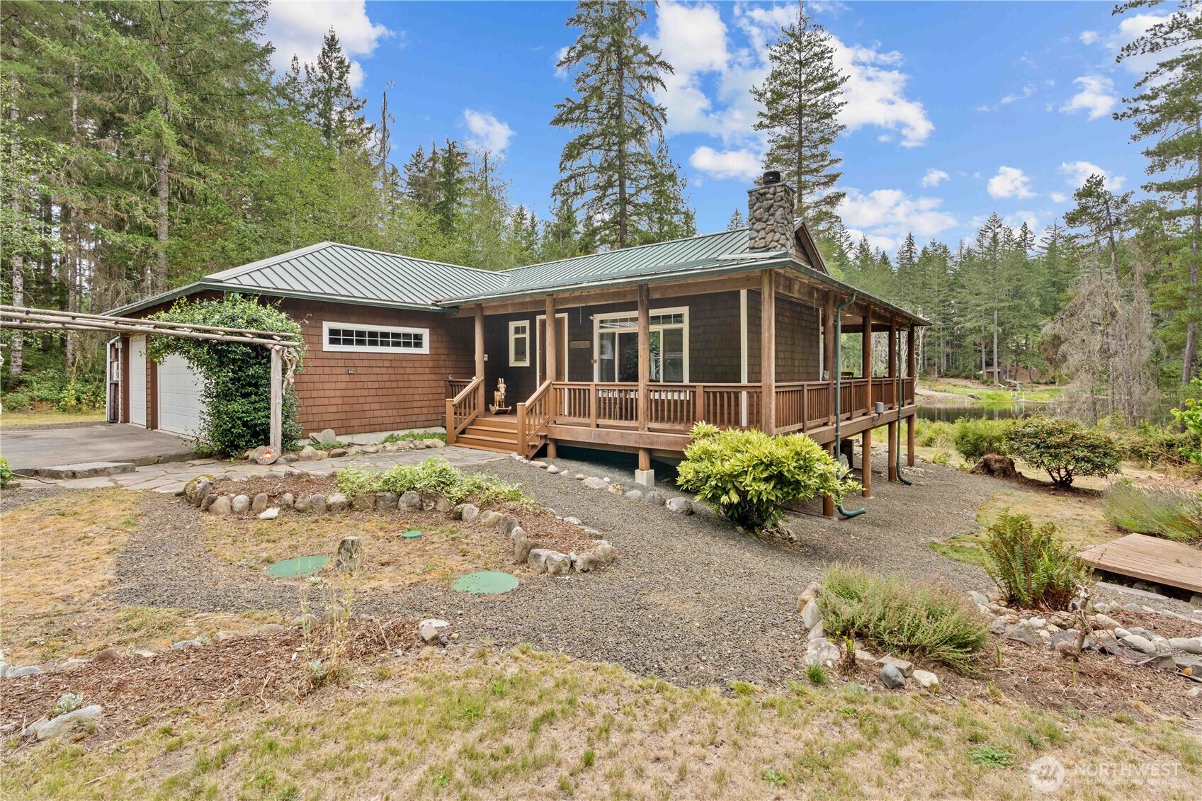 7131 Northeast Tahuya Blacksmith Road Belfair, WA 98528 - Photo 30 of 33 a front view of a house with garden