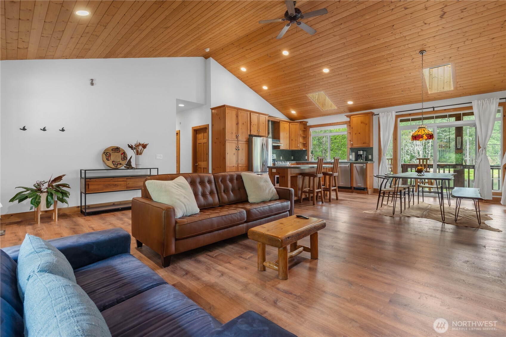 7131 Northeast Tahuya Blacksmith Road Belfair, WA 98528 - Photo 3 of 33 a living room with furniture and wooden floor