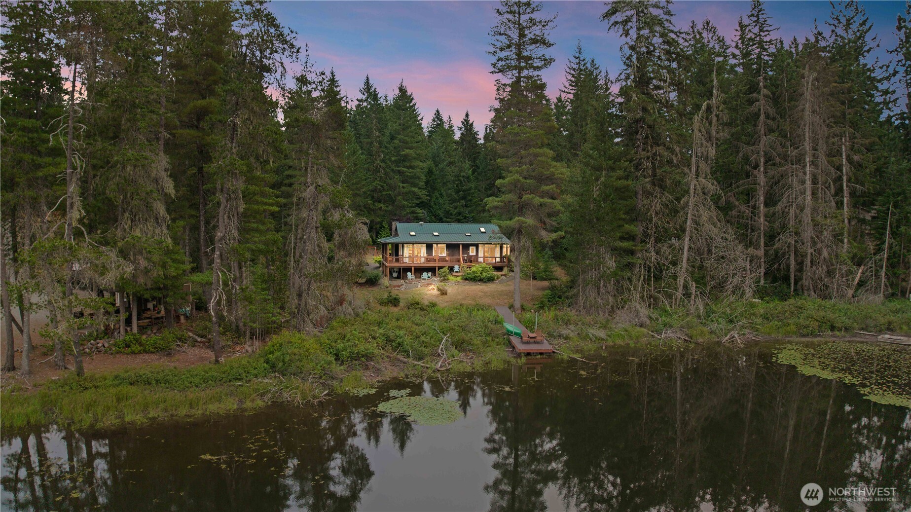 7131 Northeast Tahuya Blacksmith Road Belfair, WA 98528 - Photo 32 of 33 a view of a town with trees in the background