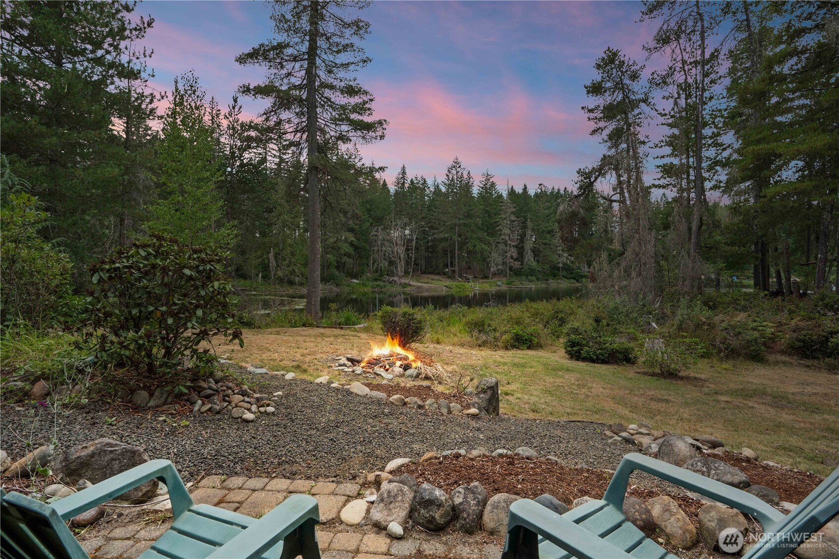 7131 Northeast Tahuya Blacksmith Road Belfair, WA 98528 - Photo 33 of 33 a view of a lake with a yard