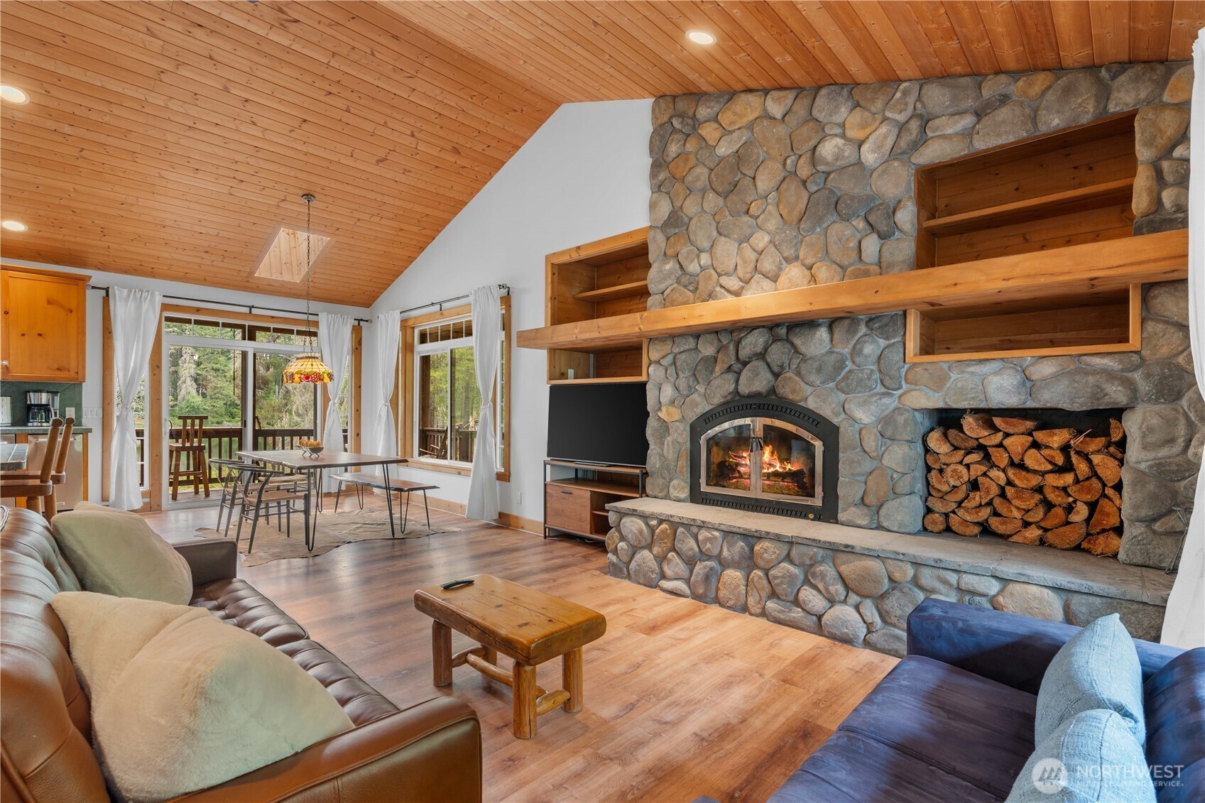 7131 Northeast Tahuya Blacksmith Road Belfair, WA 98528 - Photo 4 of 33 a living room with furniture and a fireplace