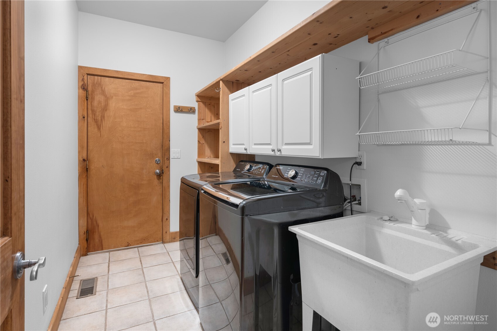 7131 Northeast Tahuya Blacksmith Road Belfair, WA 98528 - Photo 9 of 33 a utility room with sink dryer and washer