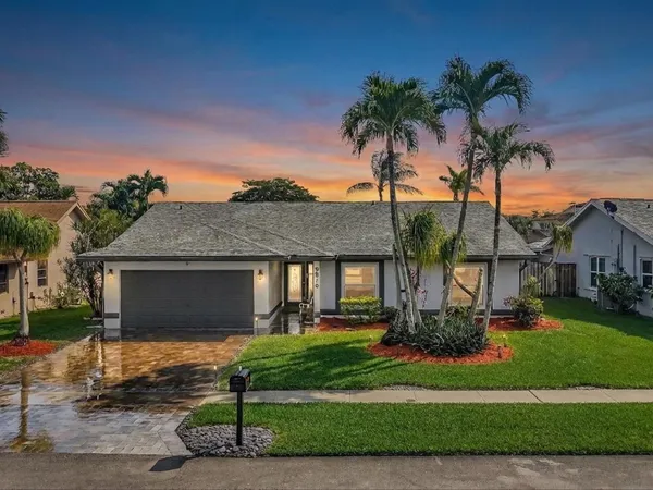 front view of a house with a yard