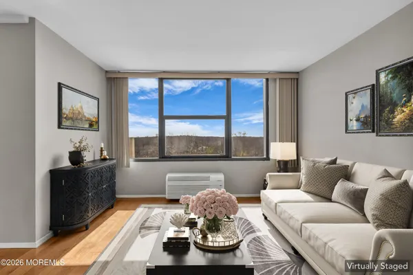 a kitchen with stainless steel appliances granite countertop wooden cabinets a sink and dishwasher a stove top oven with wooden floor