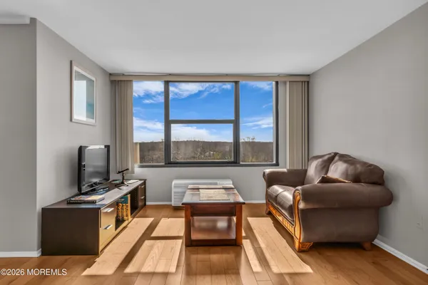 a kitchen with stainless steel appliances granite countertop a stove a sink dishwasher and a microwave oven with cabinets