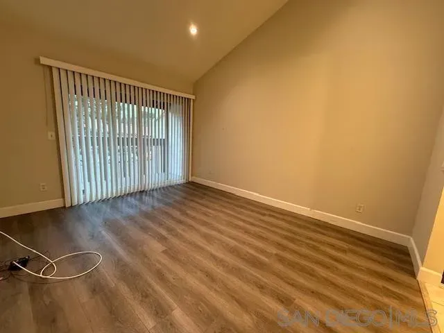 a view of a street that has couple of cars parked on the road