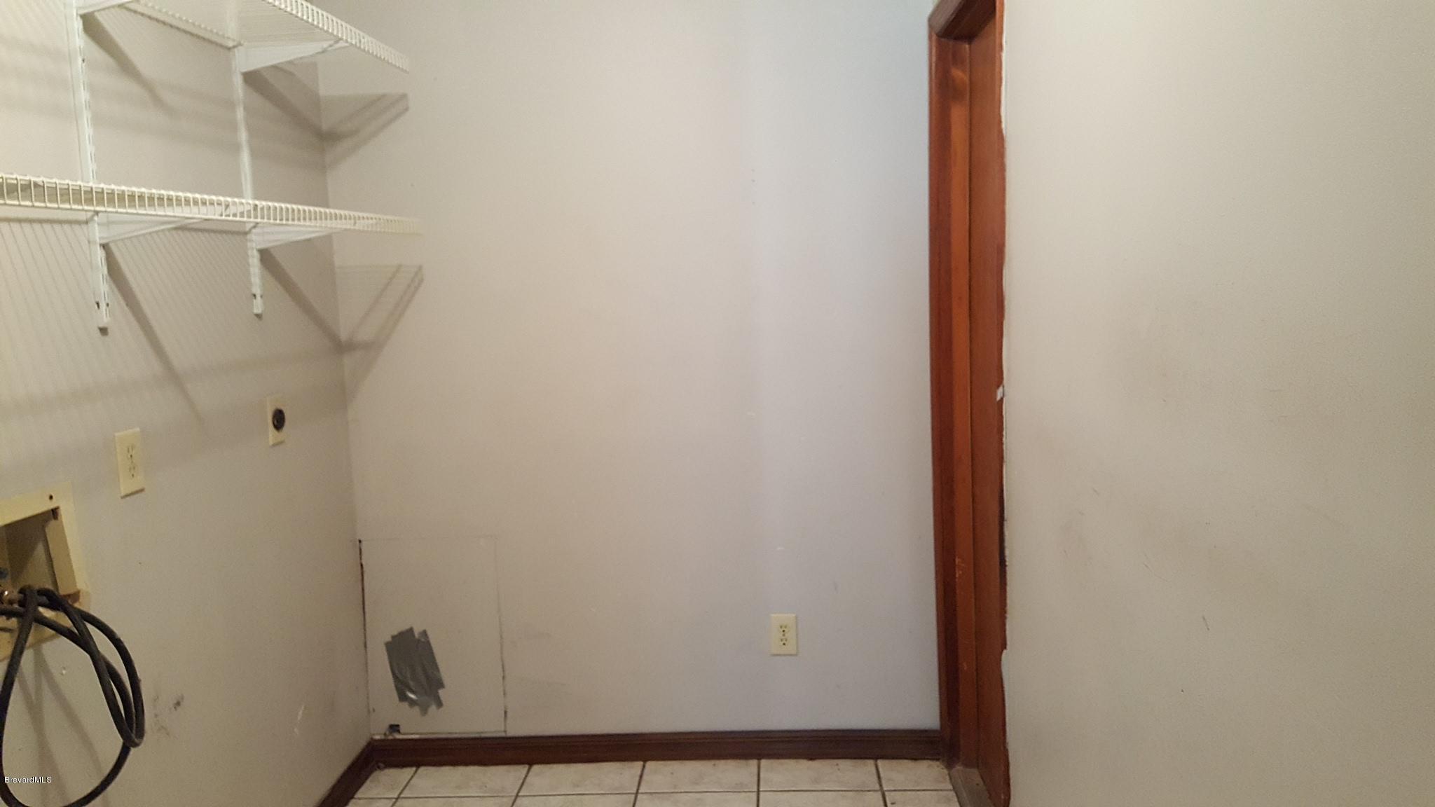 7175 Camilo Road Cocoa, FL 32927 - Photo 8 of 12 a view of small space with racks on the wall