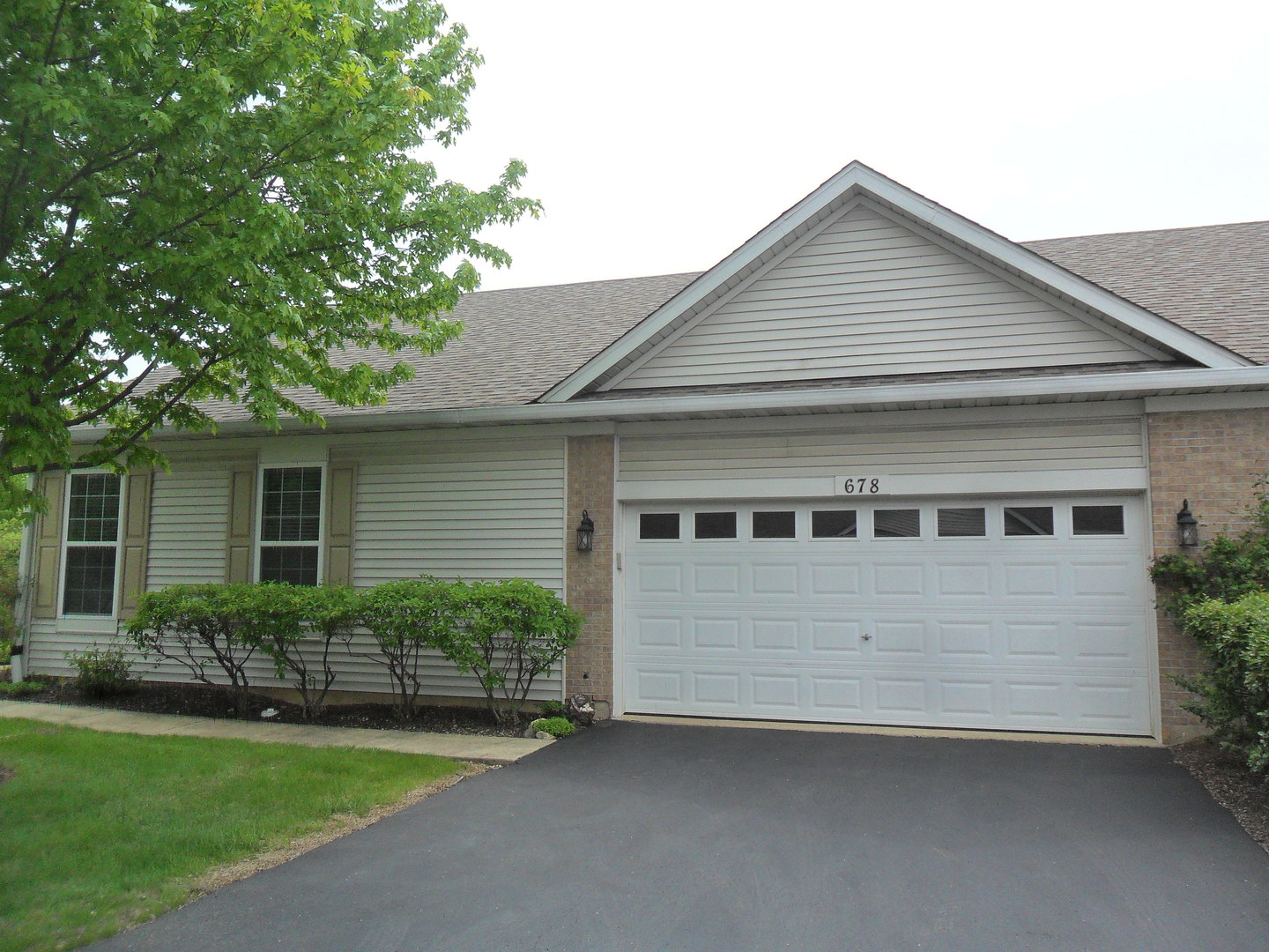 678 Cadillac Circle Romeoville, IL 60446 - Photo 15 of 19 a view of house with a yard and potted plants