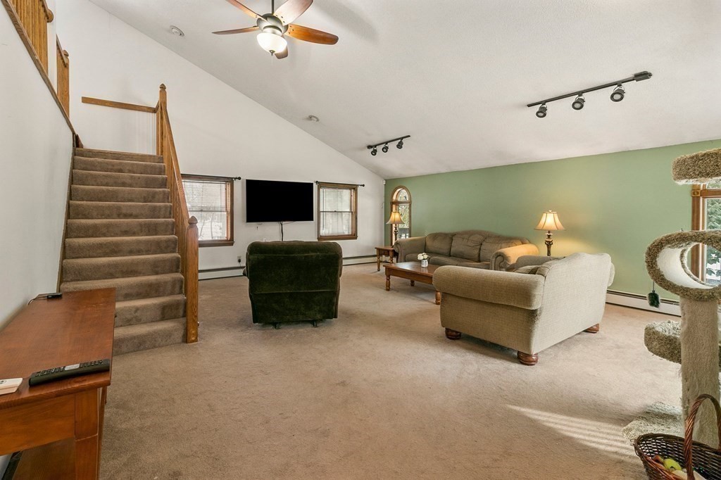 42 Birch Road Longmeadow, MA 01106 - Photo 14 of 38 a living room with furniture and a flat screen tv