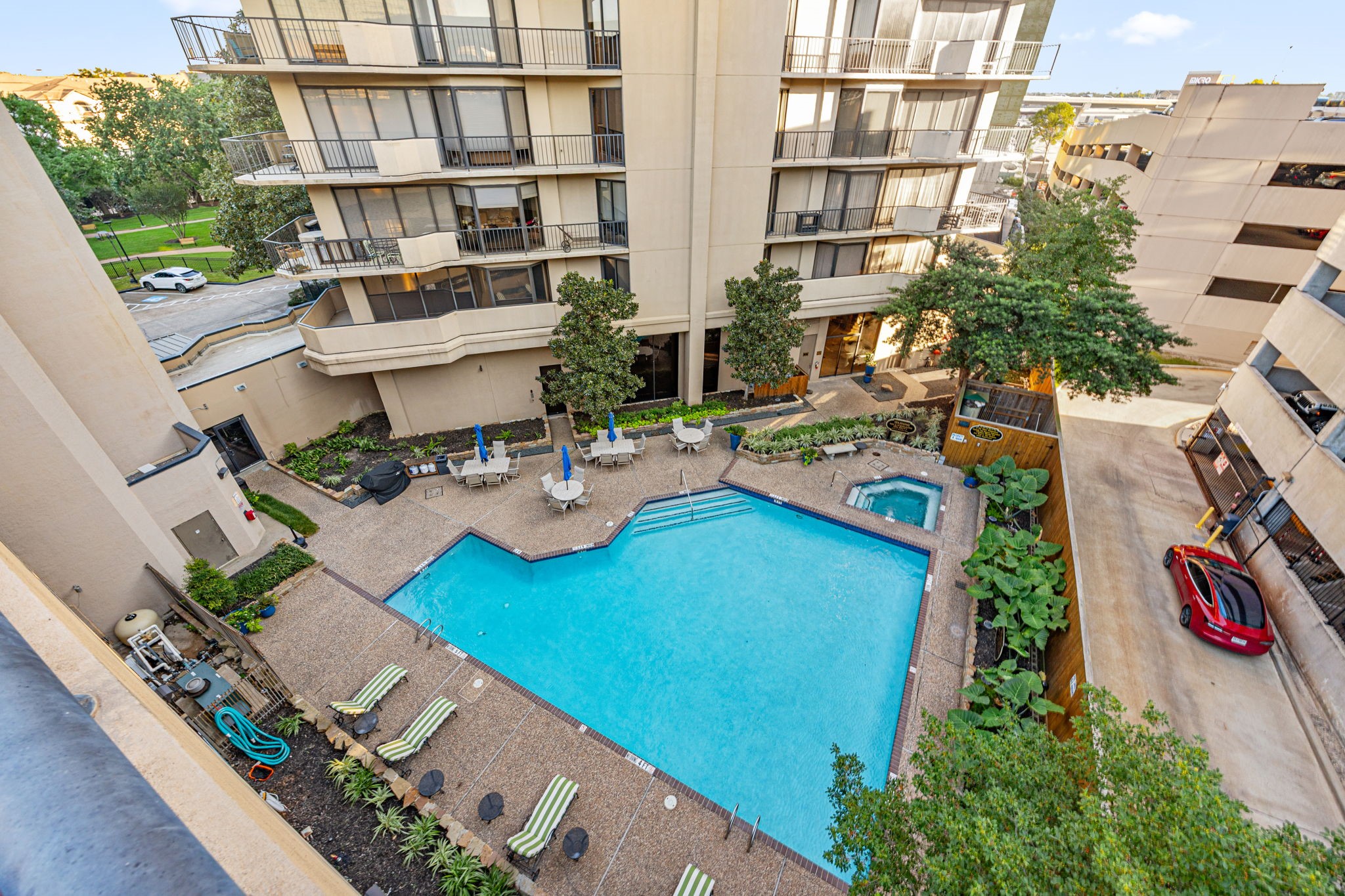 3350 McCue Road, Unit 2302 Houston, TX 77056 - Photo 27 of 35 Alternate view of the pool. Notice the lounge chairs, umbrella/tables, and hot tub...all available a short elevator ride from your front door.