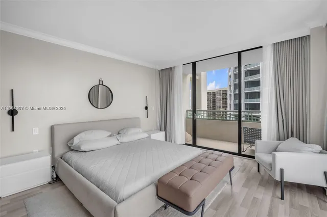 a bedroom with a large bed and a couch