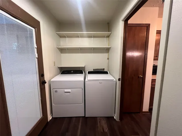 a view of storage and utility room with washer and dryer