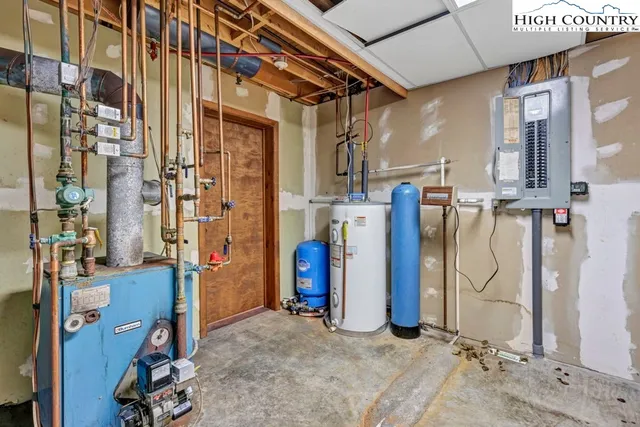 an empty room with closet and a chandelier fan