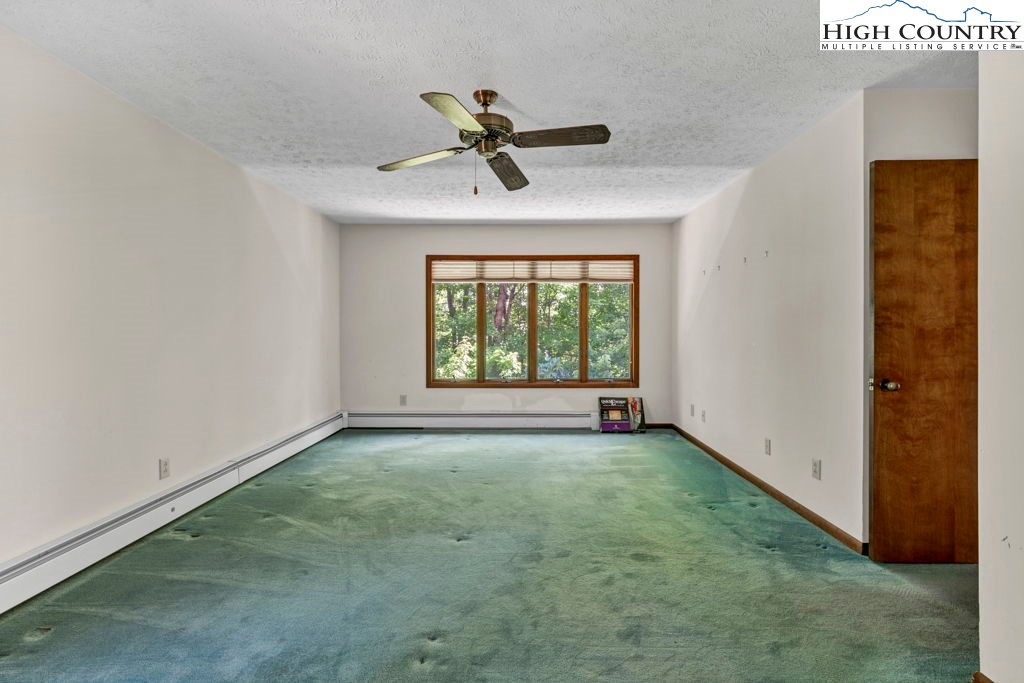 358 Devonwood Drive Boone, NC 28607 - Photo 35 of 50 a view of an empty room with a window