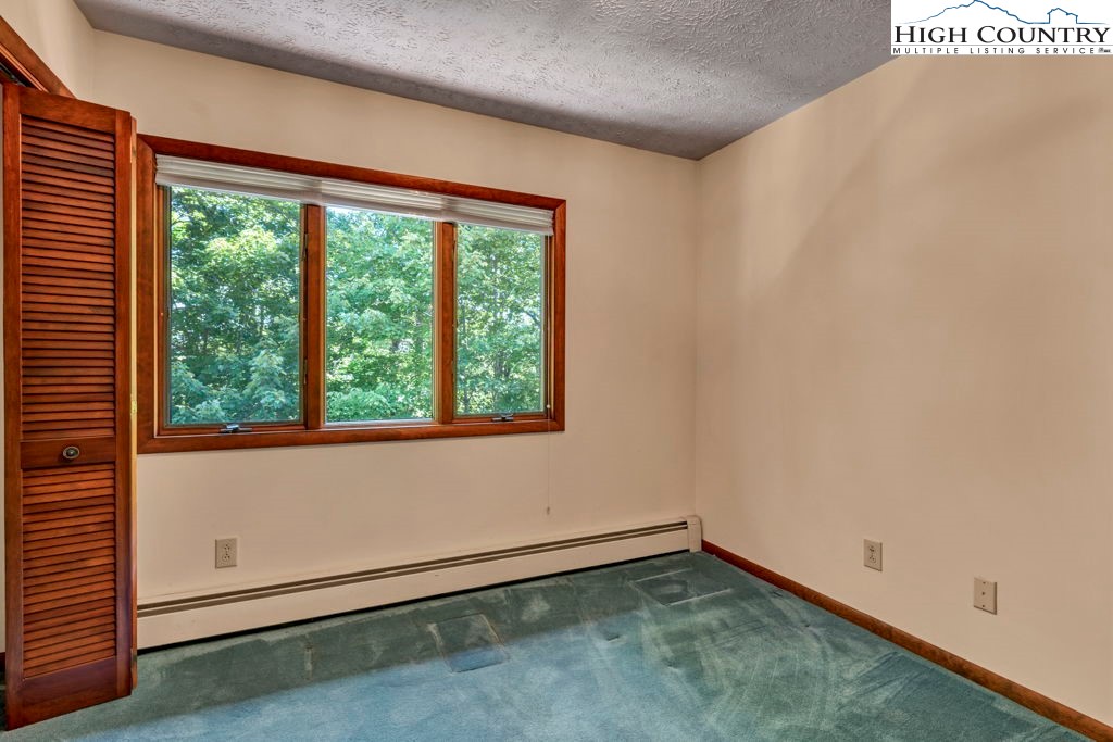 358 Devonwood Drive Boone, NC 28607 - Photo 39 of 50 an empty room with a window