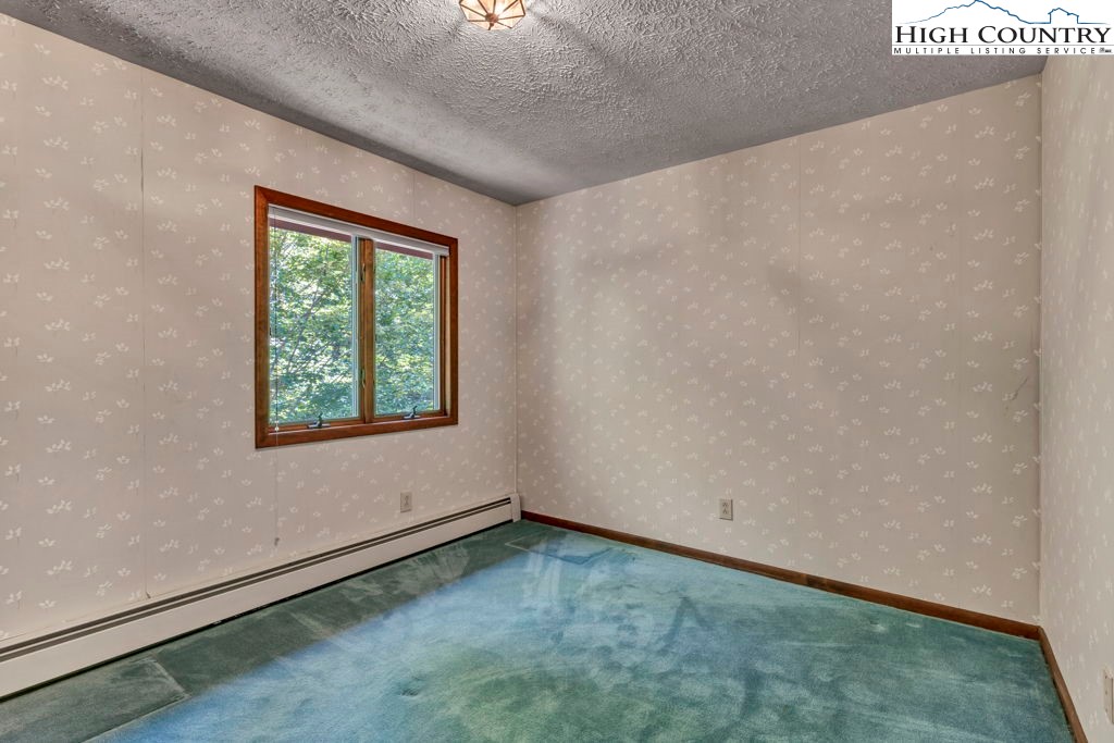 358 Devonwood Drive Boone, NC 28607 - Photo 40 of 50 an empty room with a window