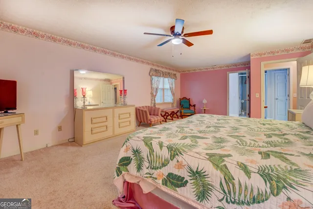 a bed room with a bed and a chandelier