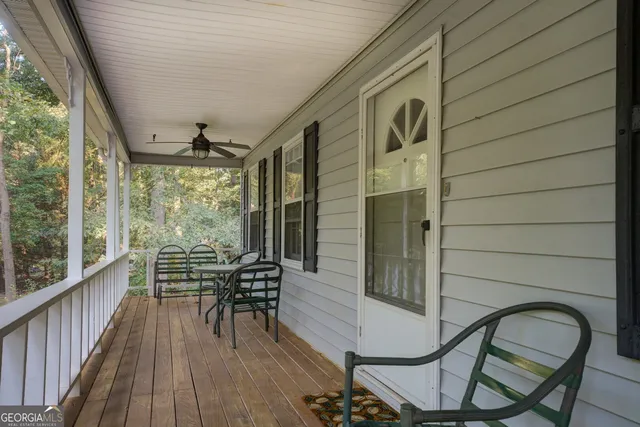 a view of a chairs and table in the balcony