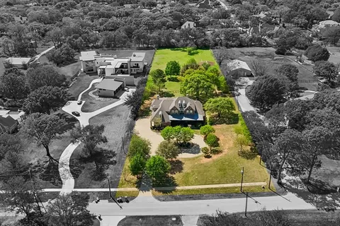 an aerial view of residential house with outdoor space